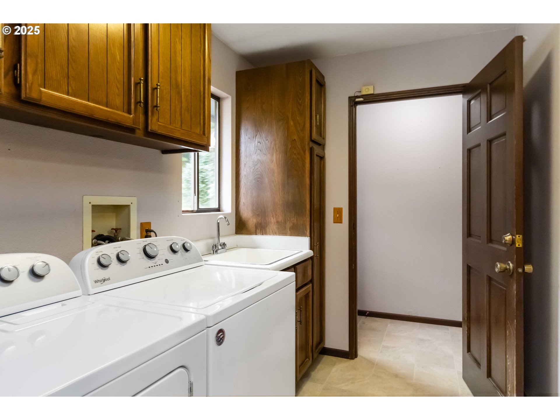 720 Abernathy Creek Road Longview, WA 98632 - Photo 22 of 44 a utility room with cabinets washer and dryer