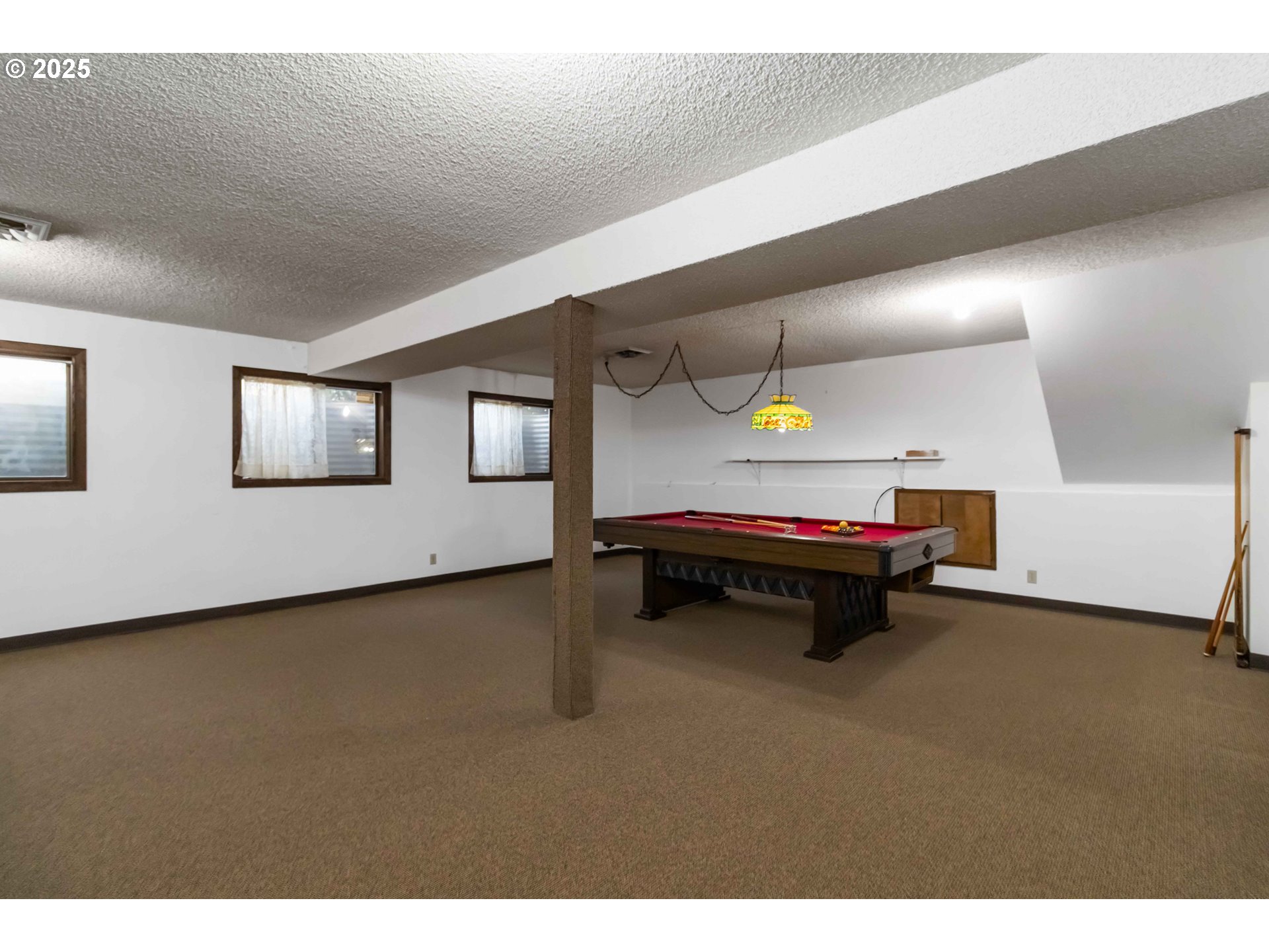 720 Abernathy Creek Road Longview, WA 98632 - Photo 23 of 44 a bedroom with furniture and a piano