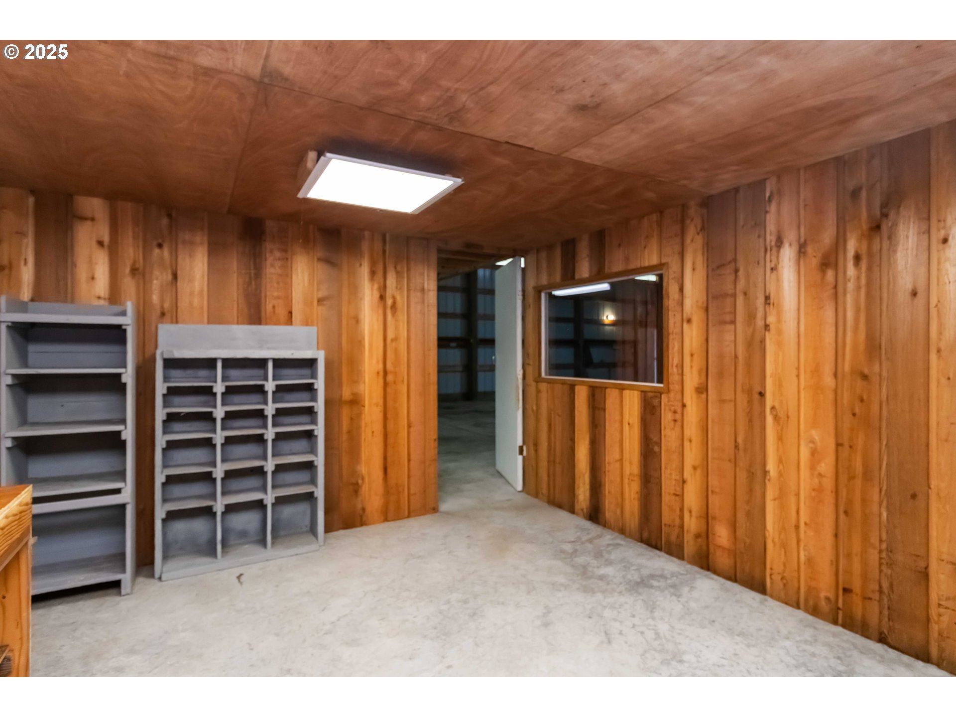 720 Abernathy Creek Road Longview, WA 98632 - Photo 39 of 44 a view of an empty room with a fireplace and a window