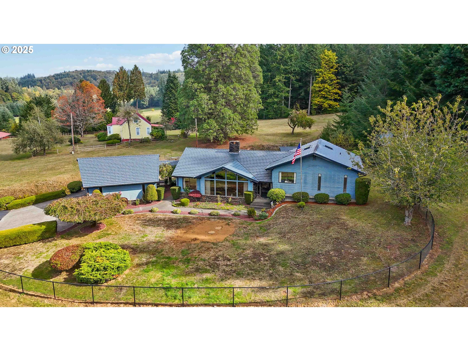 720 Abernathy Creek Road Longview, WA 98632 - Photo 42 of 44 a aerial view of a house with swimming pool and mountain view