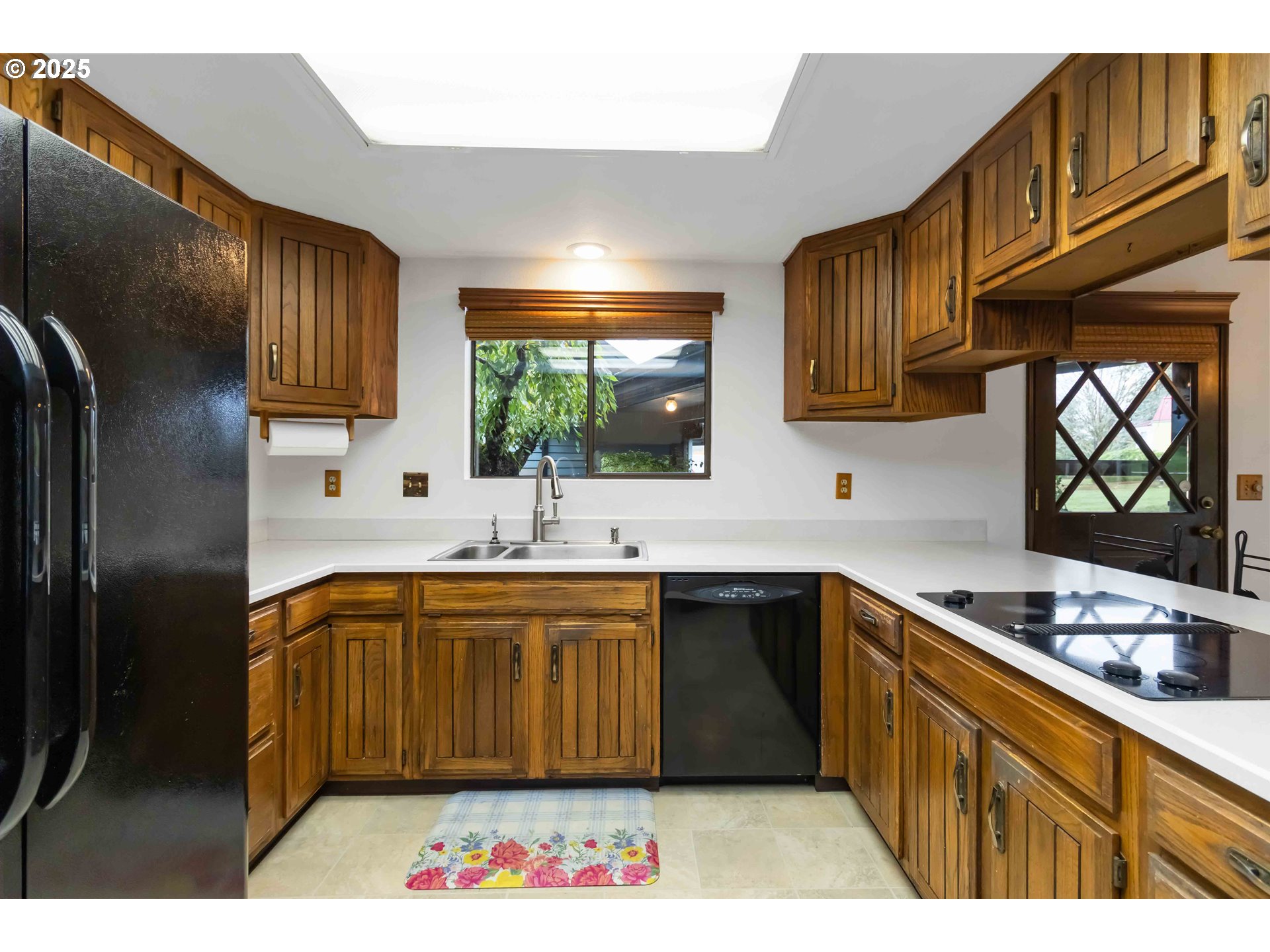 720 Abernathy Creek Road Longview, WA 98632 - Photo 8 of 44 a kitchen with stainless steel appliances granite countertop a sink dishwasher stove and refrigerator with wooden floor