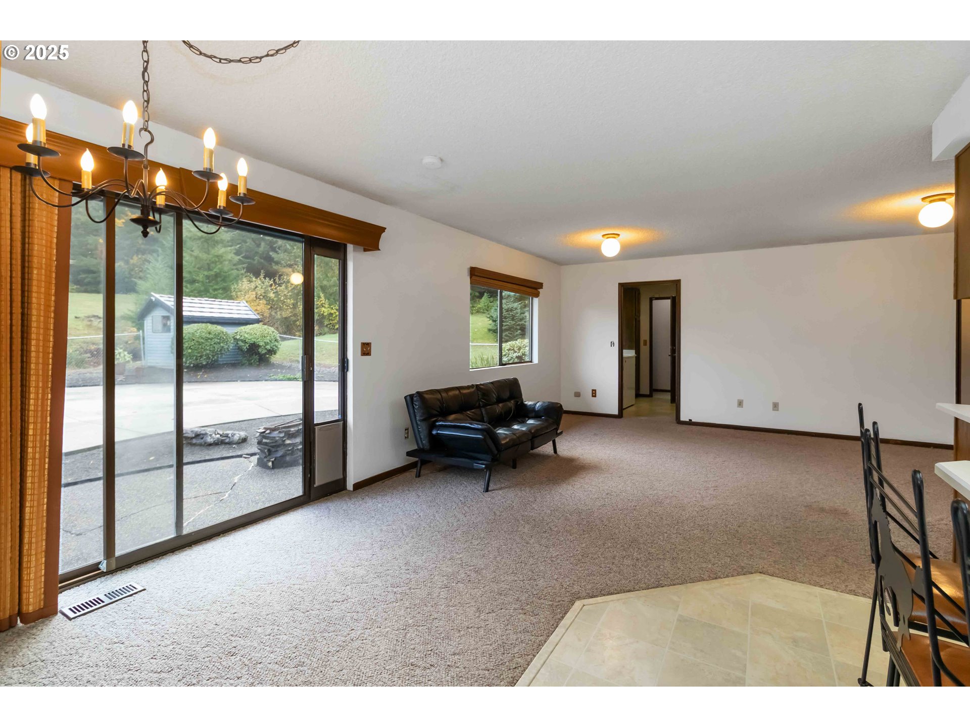 720 Abernathy Creek Road Longview, WA 98632 - Photo 9 of 44 a living room with furniture and large windows