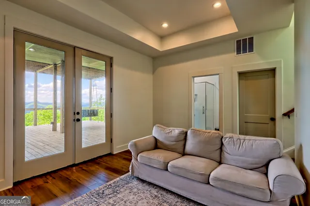an aerial view of a house with pool yard and outdoor seating