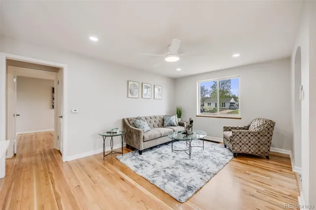 a living room with furniture and a rug