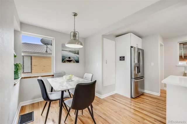 a view of a dining room with furniture window and wooden floor