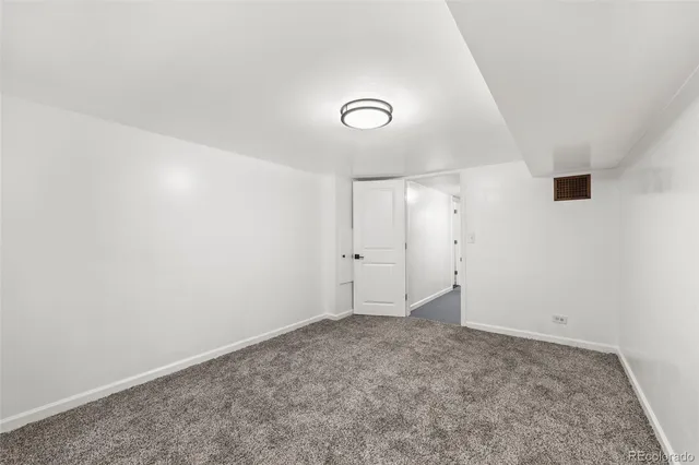 an empty room with a empty space and a window