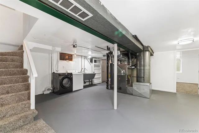 a view of a livingroom with entryway and fireplace