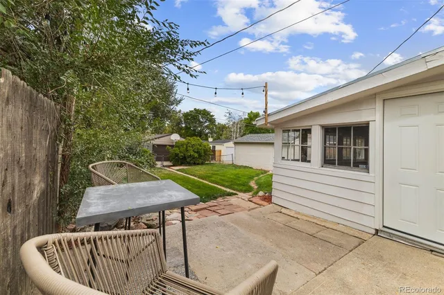 a view of a chair and fire pit in the patio
