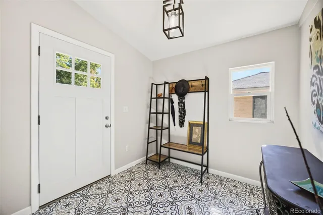a view of a livingroom with furniture and a window