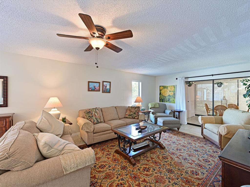 5400 34th Street West, Unit I9 Bradenton, FL 34210 - Photo 12 of 39 a living room with furniture a rug and a window