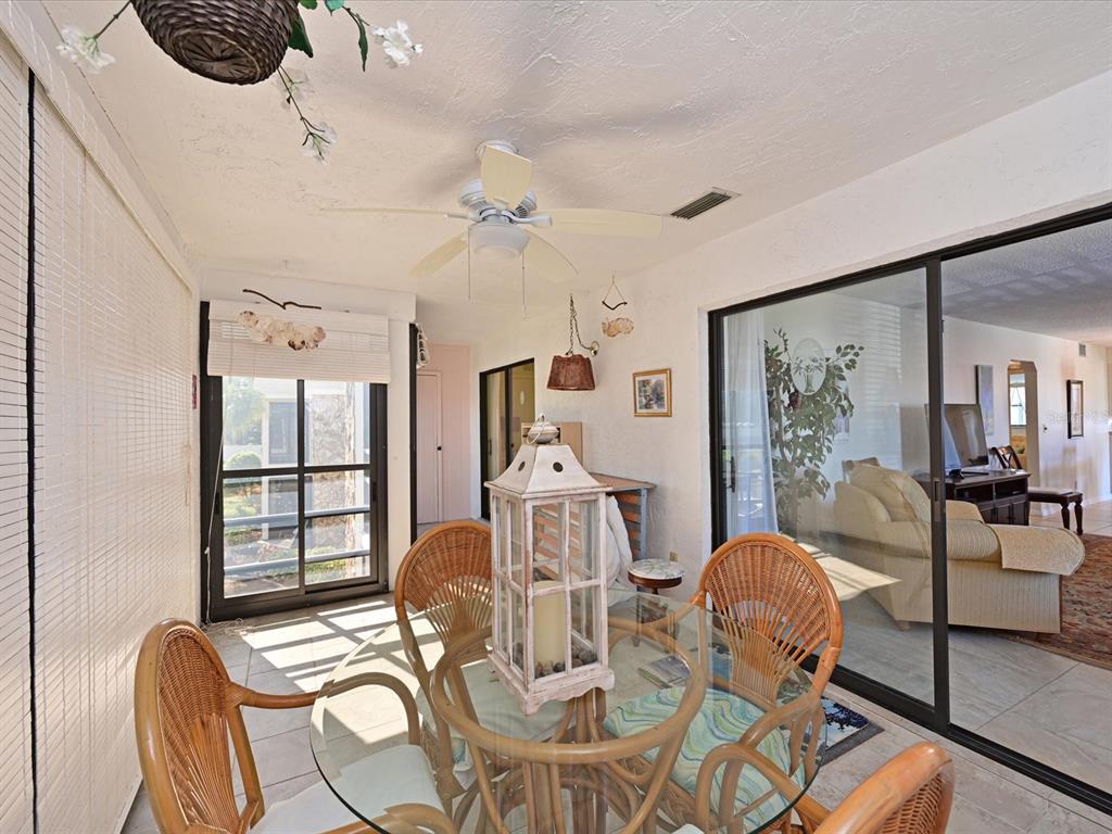 5400 34th Street West, Unit I9 Bradenton, FL 34210 - Photo 15 of 39 a view of a livingroom with furniture a window and wooden floor