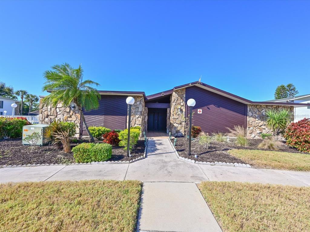 5400 34th Street West, Unit I9 Bradenton, FL 34210 - Photo 23 of 39 a front view of a house with garden