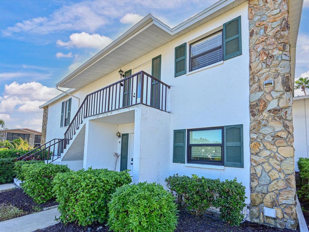 5400 34th Street West, Unit I9 Bradenton, FL 34210 - Photo 24 of 39 a front view of a house with a yard