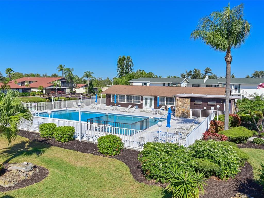 5400 34th Street West, Unit I9 Bradenton, FL 34210 - Photo 27 of 39 a front view of a house with garden