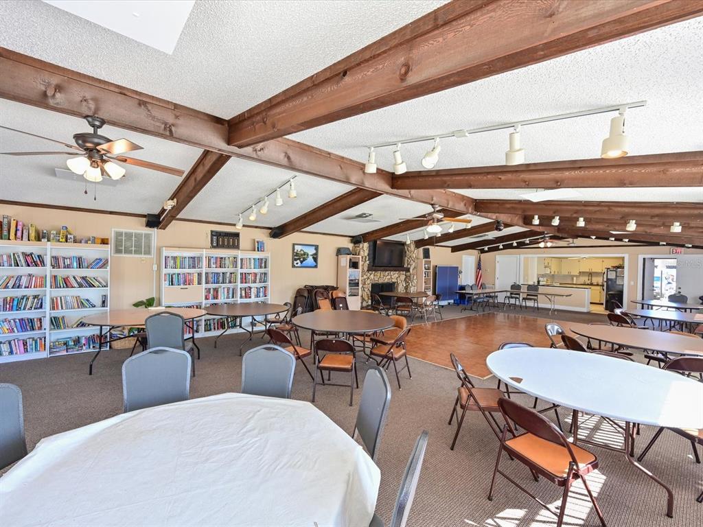 5400 34th Street West, Unit I9 Bradenton, FL 34210 - Photo 29 of 39 a living room with lots of furniture and a large window