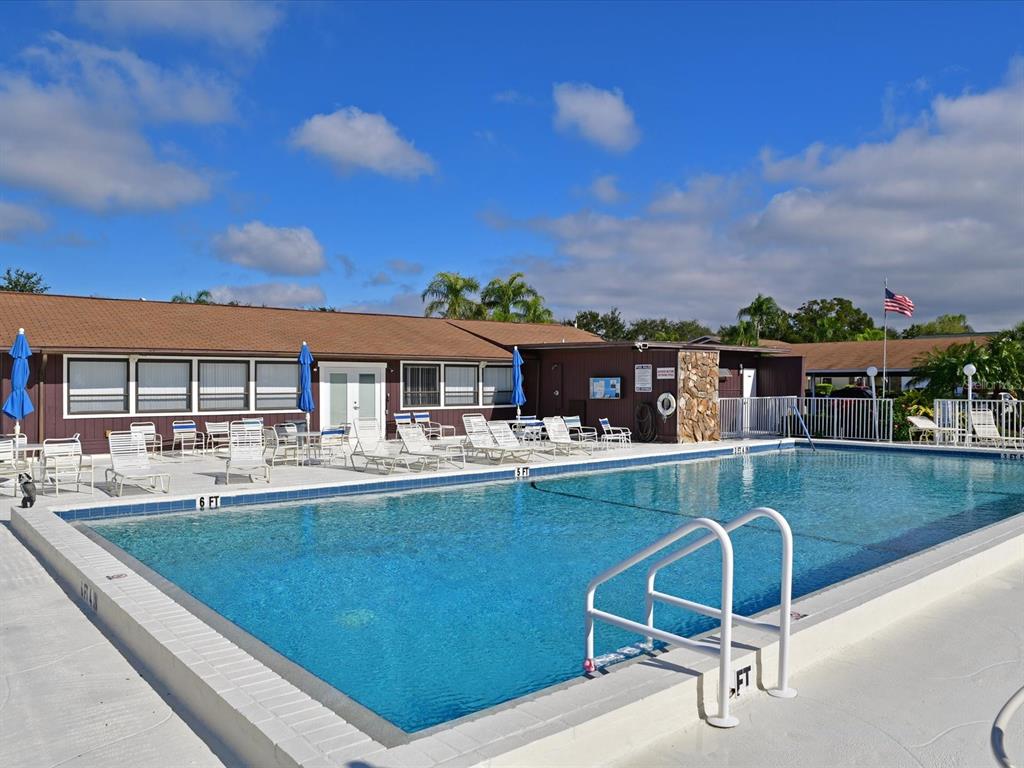 5400 34th Street West, Unit I9 Bradenton, FL 34210 - Photo 30 of 39 a view of a swimming pool with outdoor seating