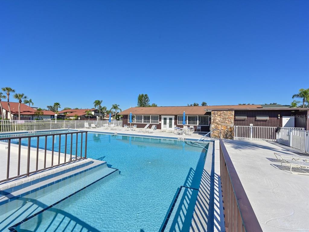 5400 34th Street West, Unit I9 Bradenton, FL 34210 - Photo 34 of 39 a view of a balcony with wooden floor and city view