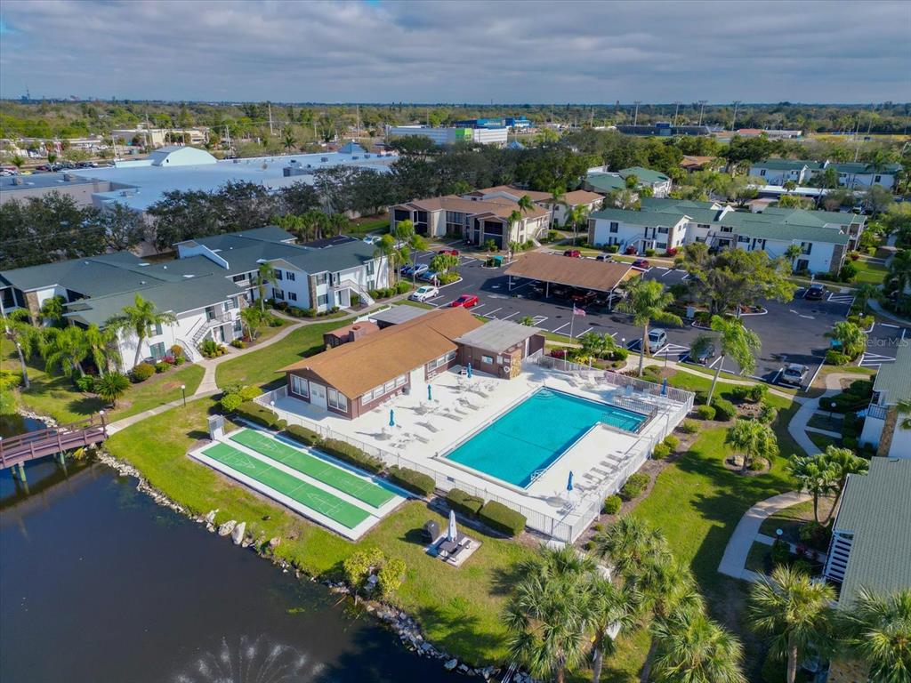 5400 34th Street West, Unit I9 Bradenton, FL 34210 - Photo 36 of 39 an aerial view of a house with a garden and lake view