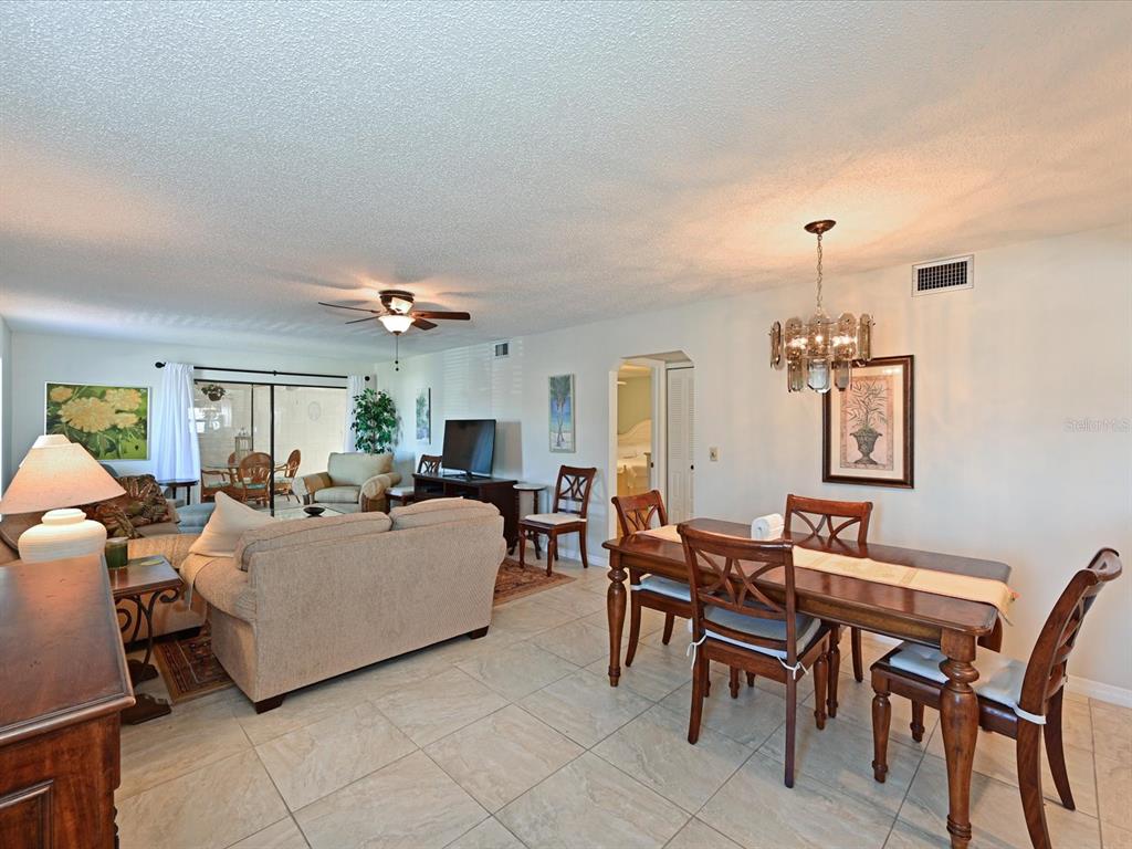 5400 34th Street West, Unit I9 Bradenton, FL 34210 - Photo 4 of 39 a living room with furniture and a dining table