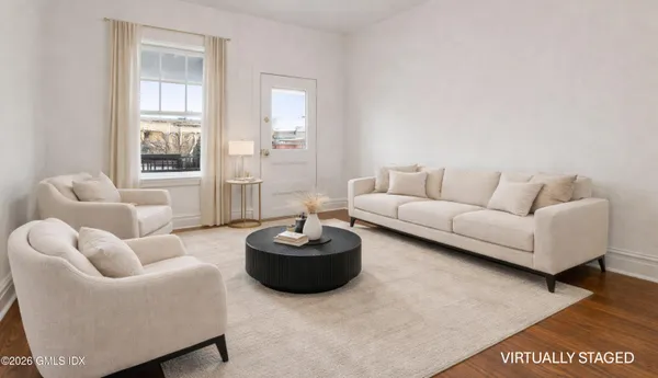 a living room with furniture and a large window