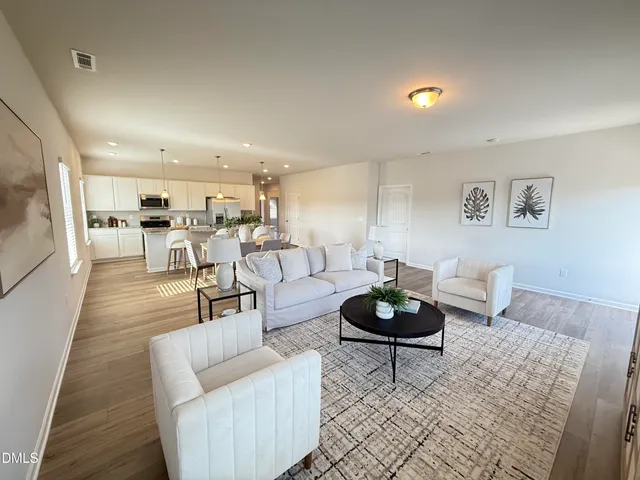 a spacious bathroom with a double vanity sink mirror and shower