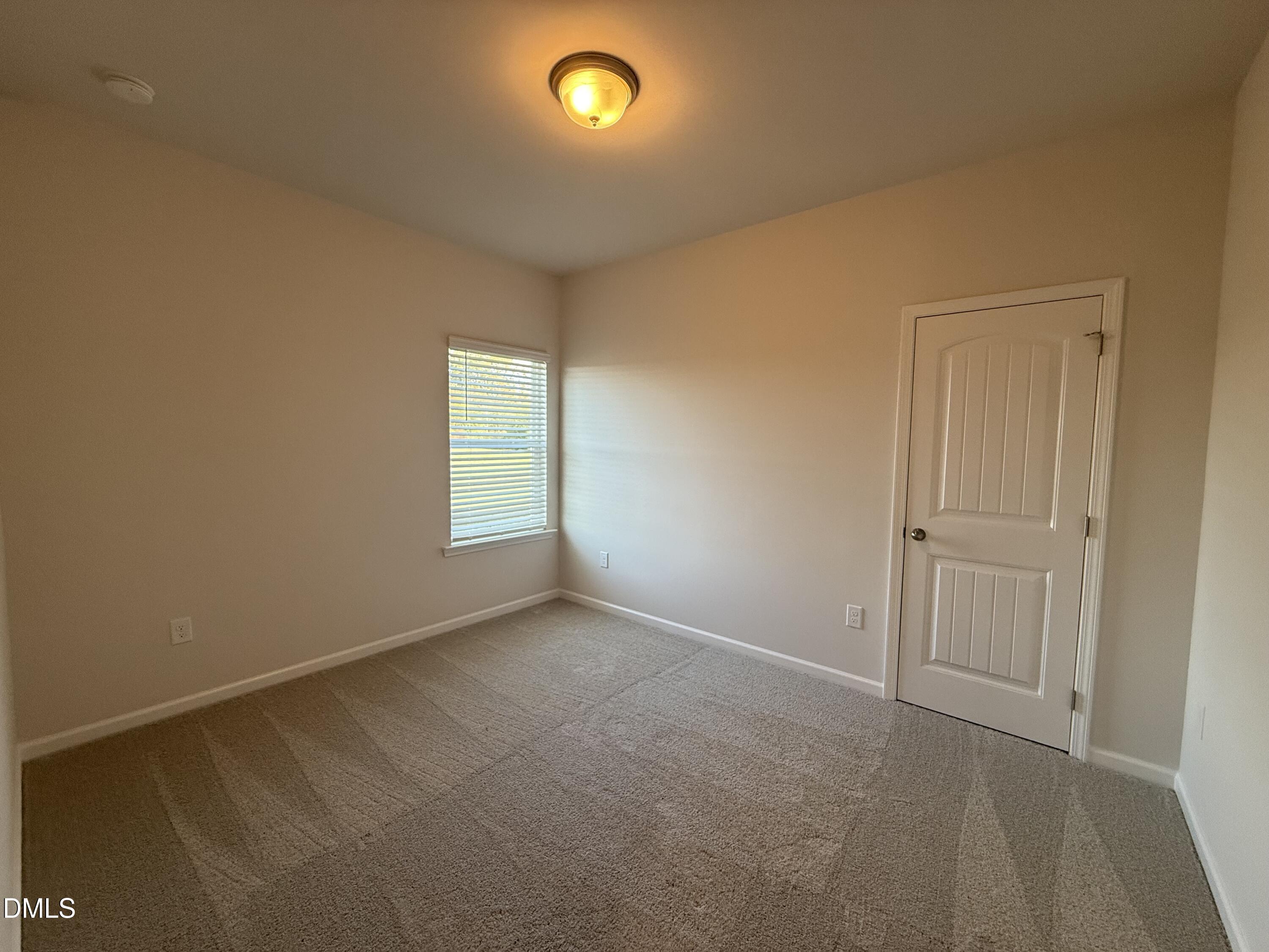 48 Spirit Spgs Road Smithfield, NC 27577 - Photo 13 of 24 an empty room with windows
