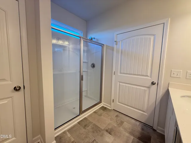 a view of a house with a yard and a pond