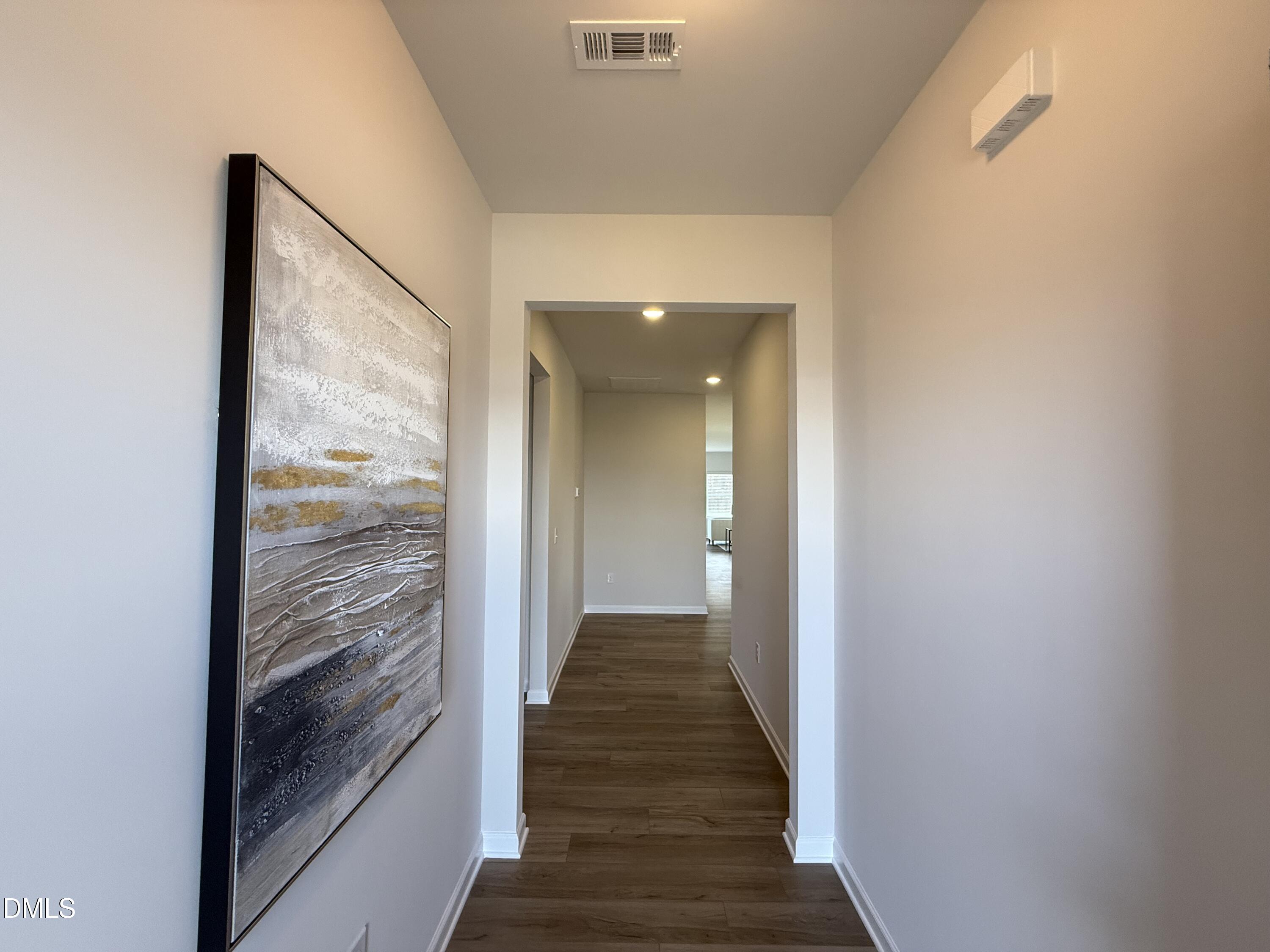 48 Spirit Spgs Road Smithfield, NC 27577 - Photo 3 of 24 a view of a hallway with wooden floor and staircase