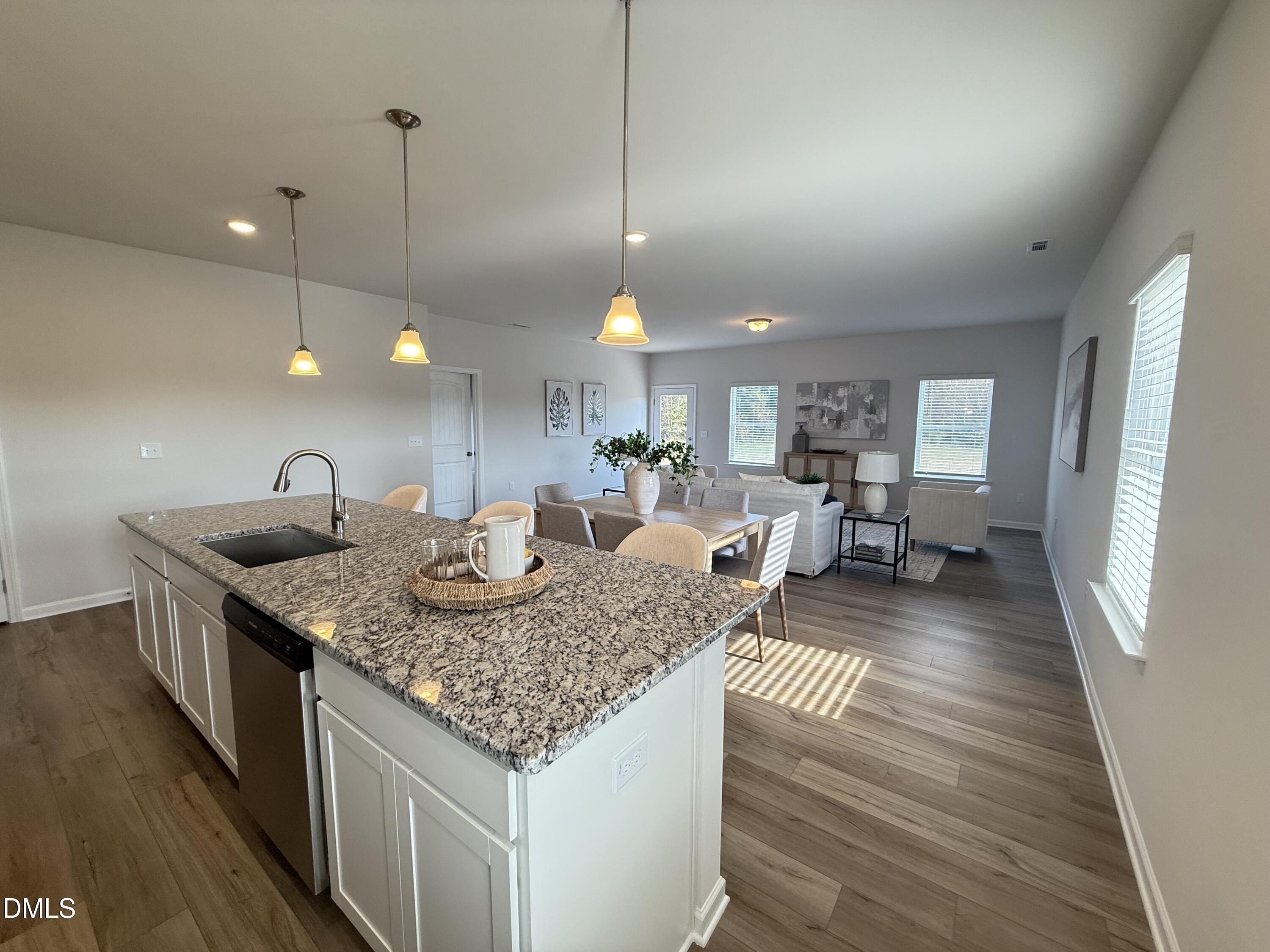 48 Spirit Spgs Road Smithfield, NC 27577 - Photo 9 of 24 a kitchen with center island attached living room