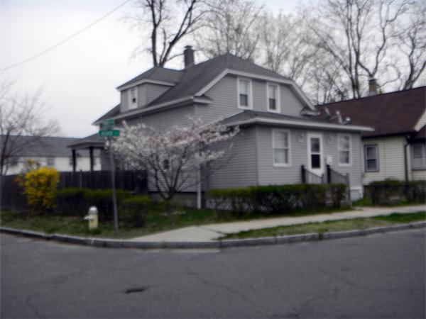 23 Jasper Street Springfield, MA 01109 - Photo 3 of 9 a front view of a house with a yard