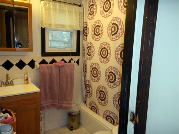 23 Jasper Street Springfield, MA 01109 - Photo 9 of 9 a bathroom with a sink and a mirror