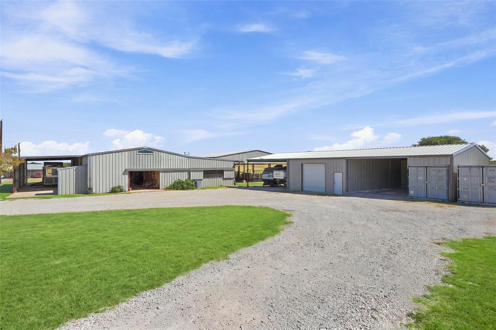 900 Leech Road Poolville, TX 76487 - Photo 20 of 40 Trailer storage, barn, feed room, extra storage