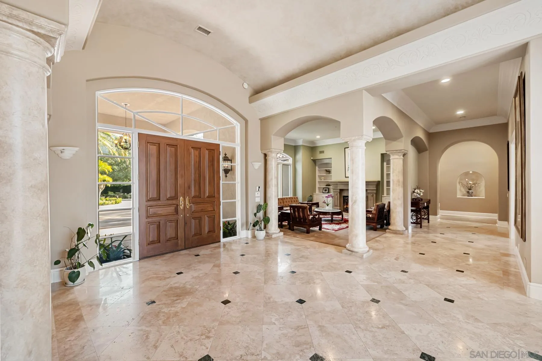 18050 Rancho La Cima Corte Rancho Santa Fe, CA 92067 - Photo 11 of 57 a view of a livingroom with furniture and hallway