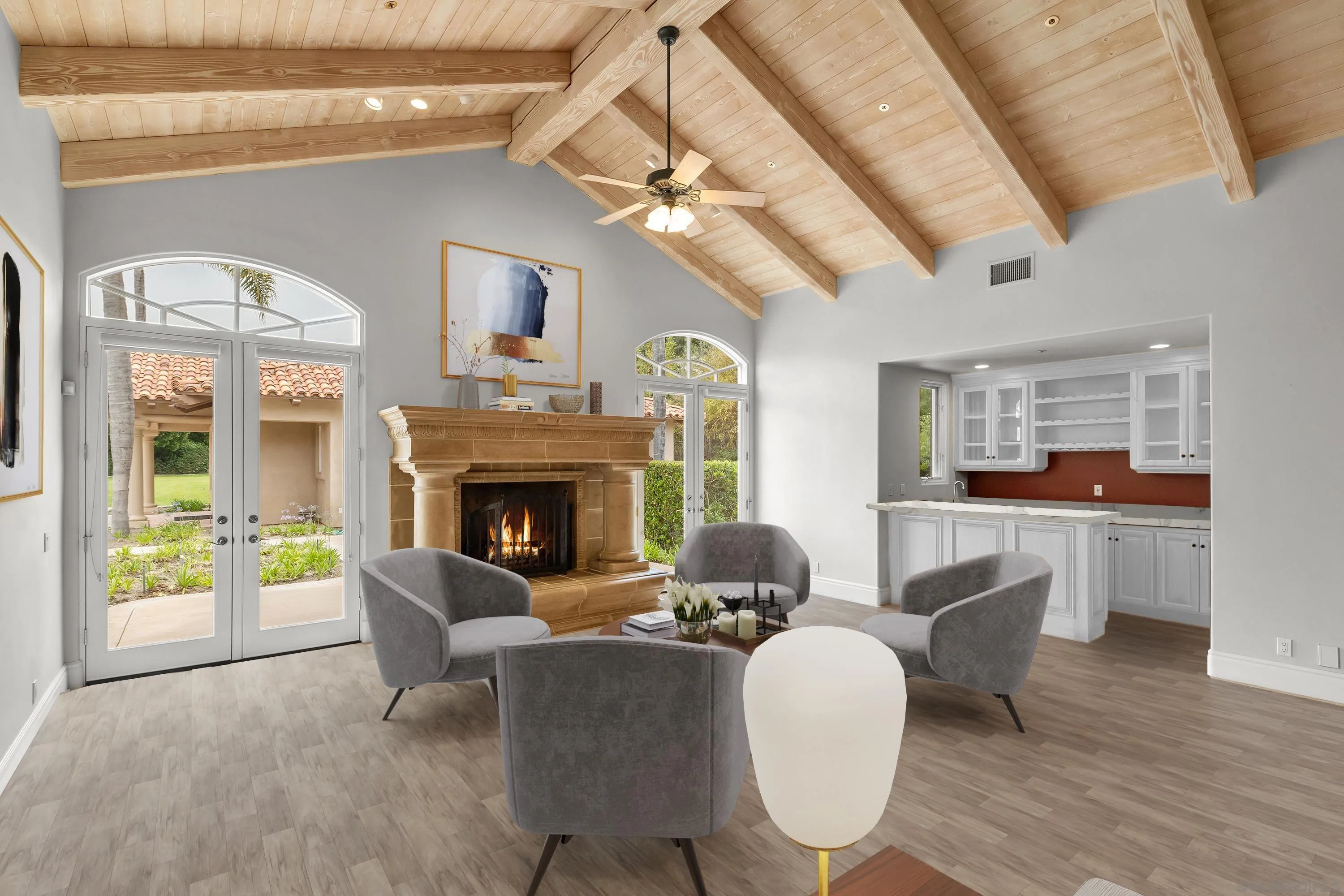 18050 Rancho La Cima Corte Rancho Santa Fe, CA 92067 - Photo 18 of 57 a living room with furniture a fireplace and a chandelier