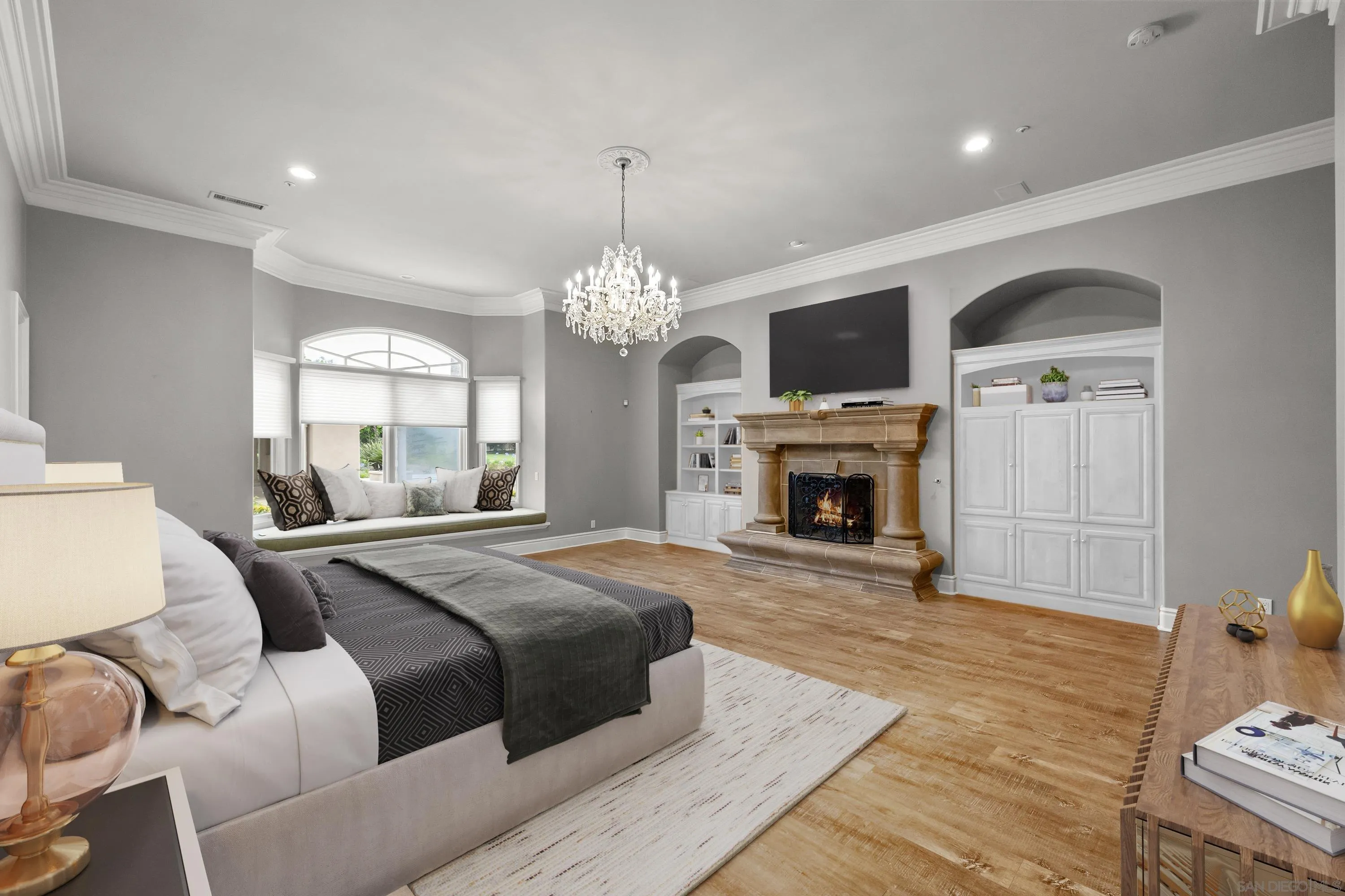 18050 Rancho La Cima Corte Rancho Santa Fe, CA 92067 - Photo 27 of 57 a spacious bedroom with a bed and a fireplace