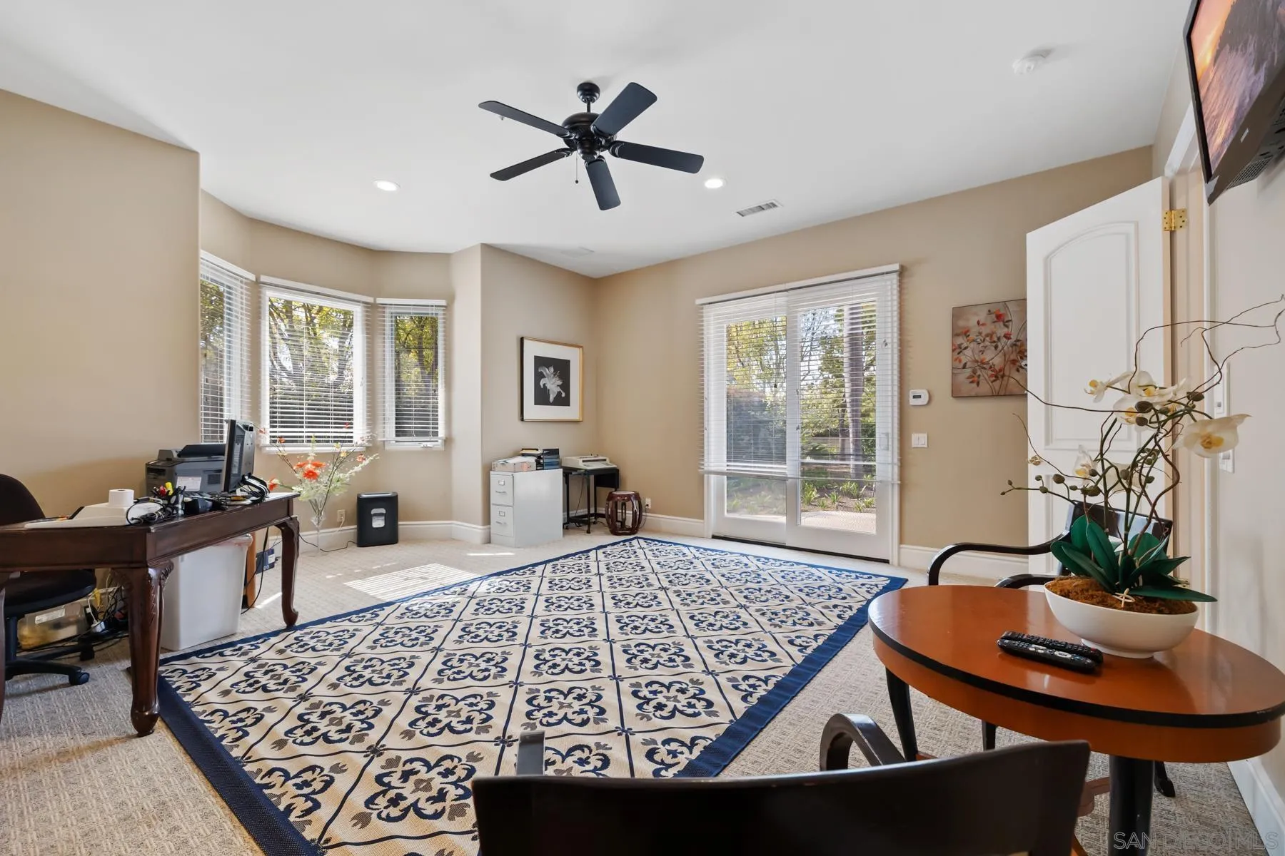 18050 Rancho La Cima Corte Rancho Santa Fe, CA 92067 - Photo 28 of 57 a living room with furniture and a large window