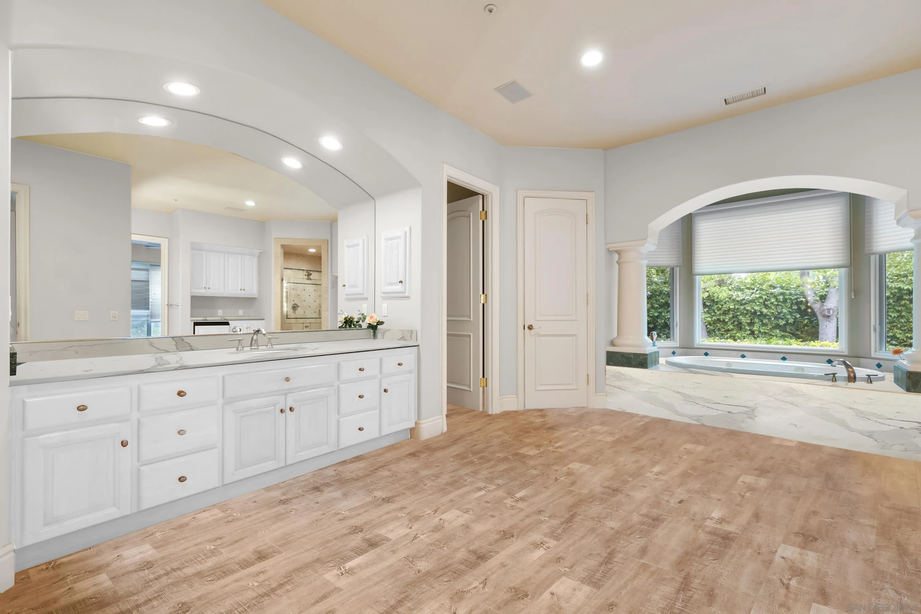 18050 Rancho La Cima Corte Rancho Santa Fe, CA 92067 - Photo 29 of 57 a spacious bathroom with double vanity and a mirror