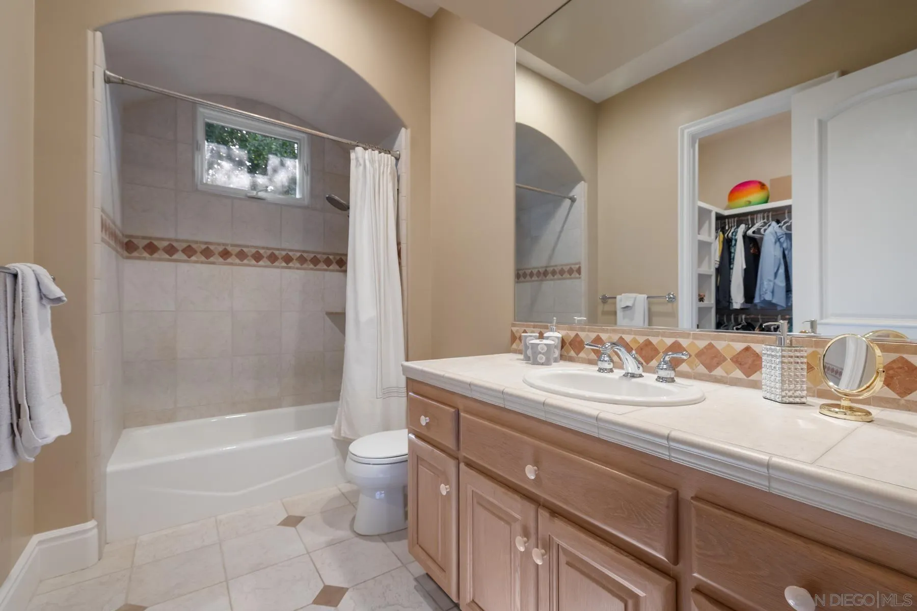 18050 Rancho La Cima Corte Rancho Santa Fe, CA 92067 - Photo 34 of 57 a bathroom with a sink a toilet and a bathtub