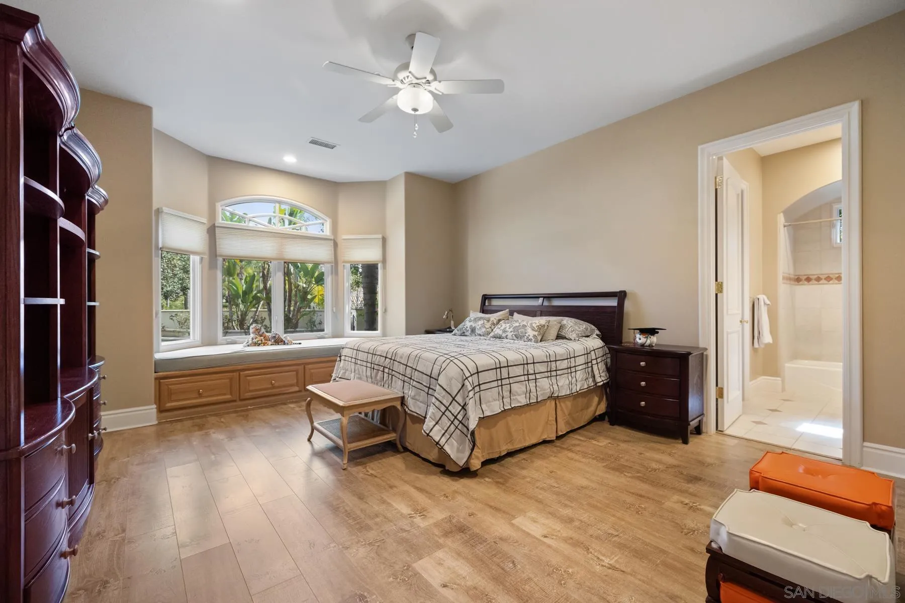 18050 Rancho La Cima Corte Rancho Santa Fe, CA 92067 - Photo 35 of 57 a bedroom with a large bed and a chandelier