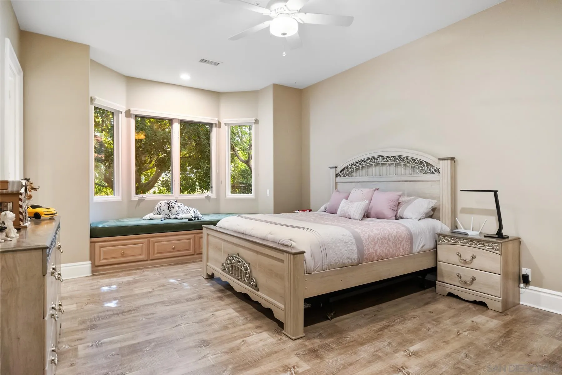 18050 Rancho La Cima Corte Rancho Santa Fe, CA 92067 - Photo 36 of 57 a bedroom with a bed and a large window