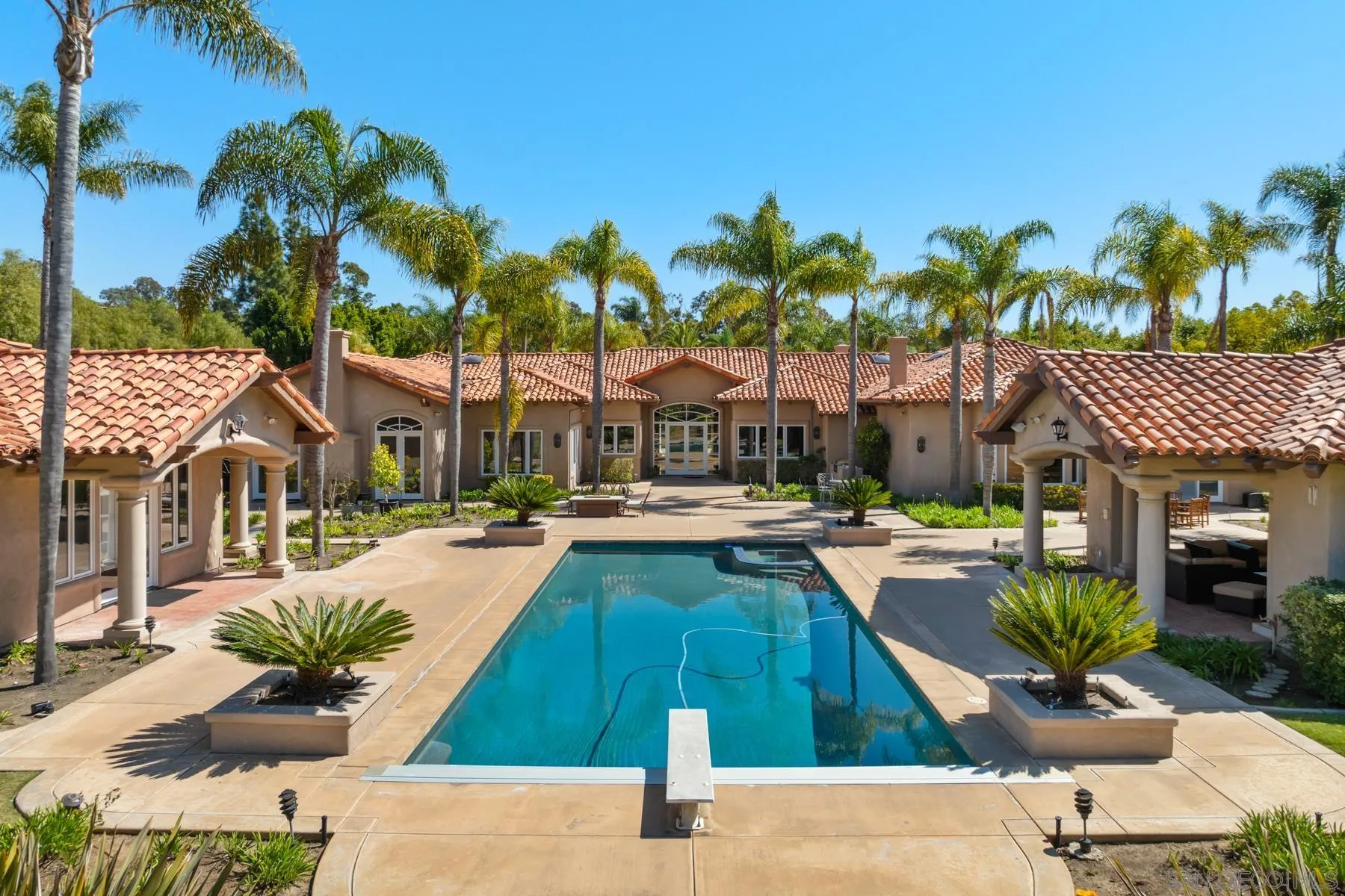 18050 Rancho La Cima Corte Rancho Santa Fe, CA 92067 - Photo 39 of 57 a swimming pool with outdoor seating and yard