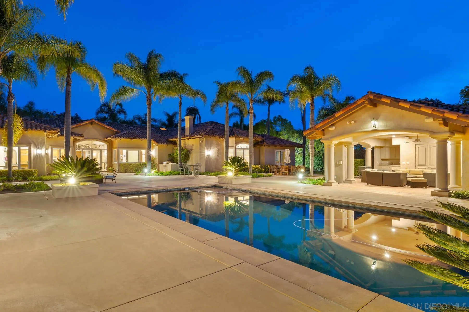 18050 Rancho La Cima Corte Rancho Santa Fe, CA 92067 - Photo 4 of 57 a view of a house with swimming pool and sitting area