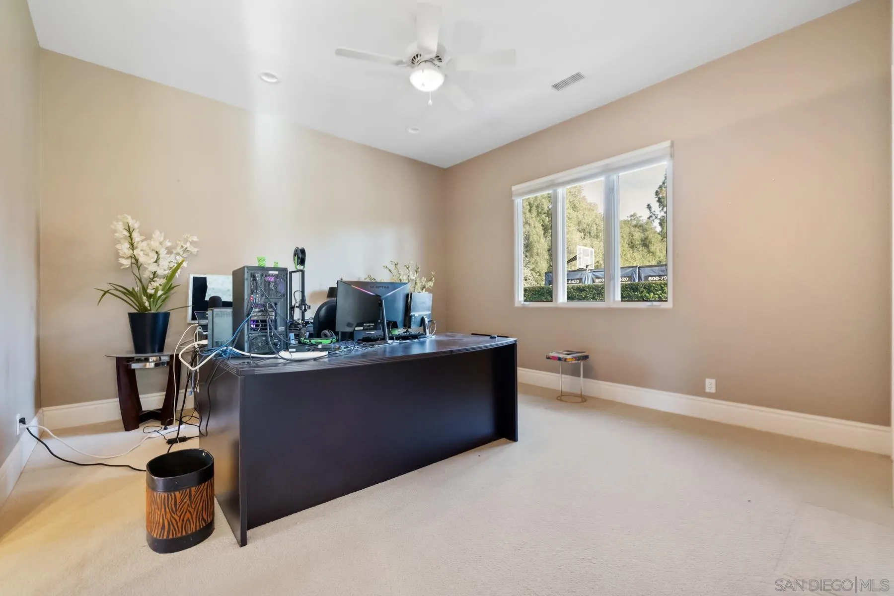 18050 Rancho La Cima Corte Rancho Santa Fe, CA 92067 - Photo 50 of 57 a living room with furniture and a window