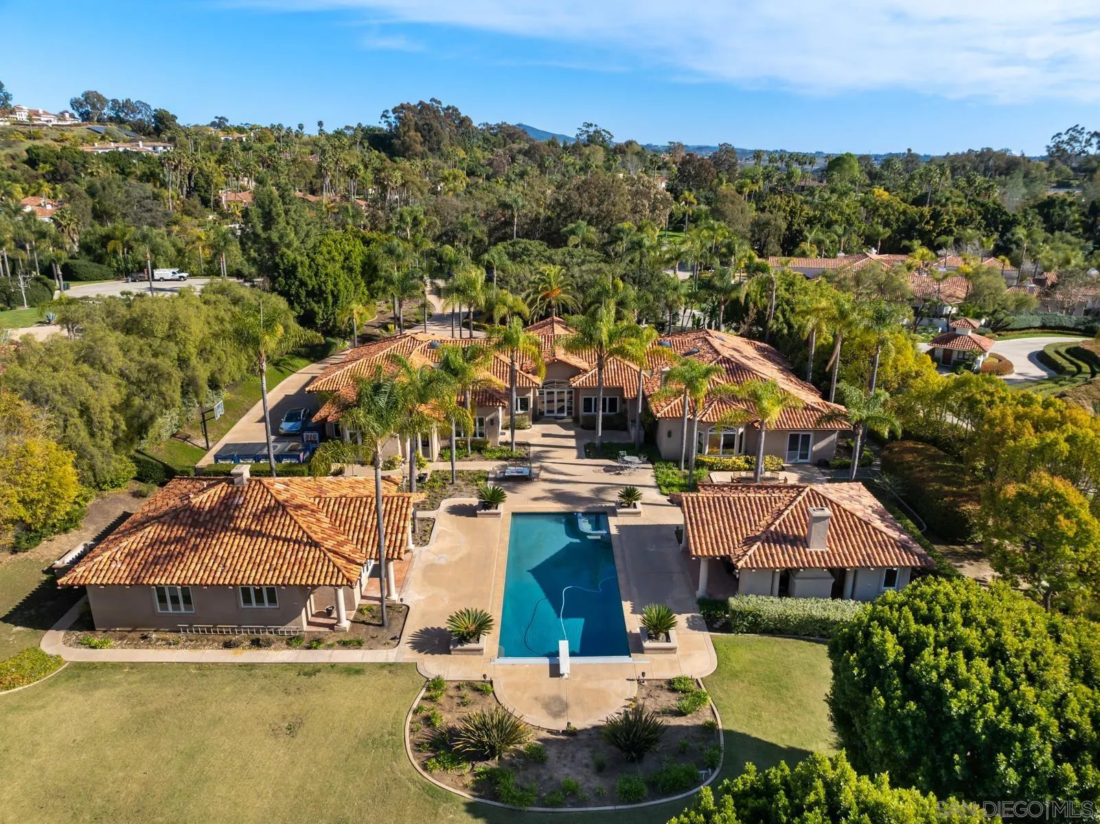 18050 Rancho La Cima Corte Rancho Santa Fe, CA 92067 - Photo 5 of 57 an aerial view of a house with a ocean view