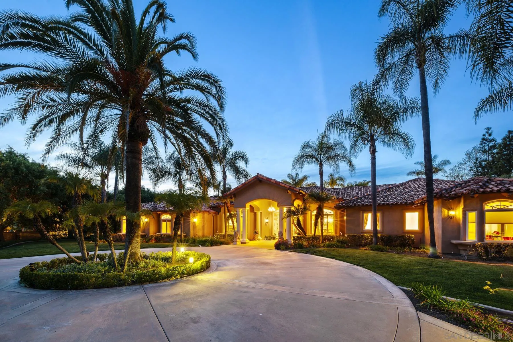 18050 Rancho La Cima Corte Rancho Santa Fe, CA 92067 - Photo 9 of 57 a view of a house with a yard and palm trees