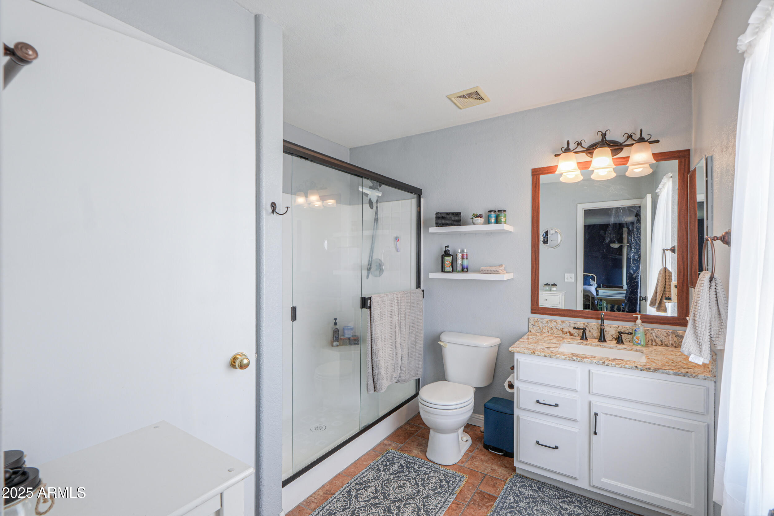 3433 South Chaparral Road Apache Junction, AZ 85119 - Photo 23 of 37 a spacious bathroom with a double vanity sink mirror and toilet