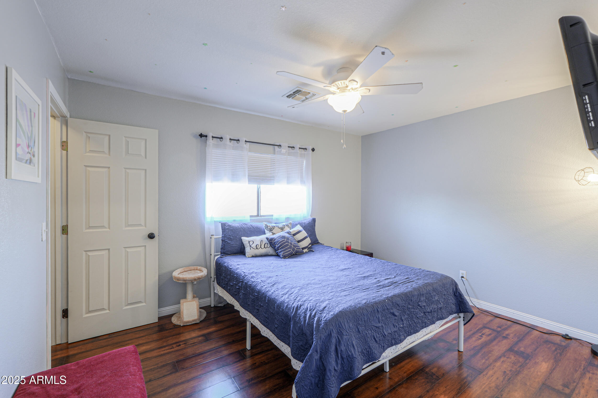 3433 South Chaparral Road Apache Junction, AZ 85119 - Photo 26 of 37 a spacious bedroom with a bed and a window