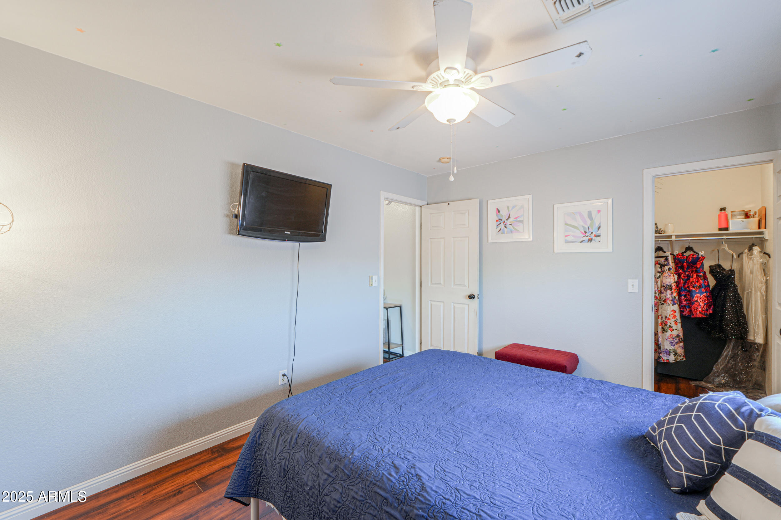 3433 South Chaparral Road Apache Junction, AZ 85119 - Photo 27 of 37 a bedroom with a bed and a flat screen tv