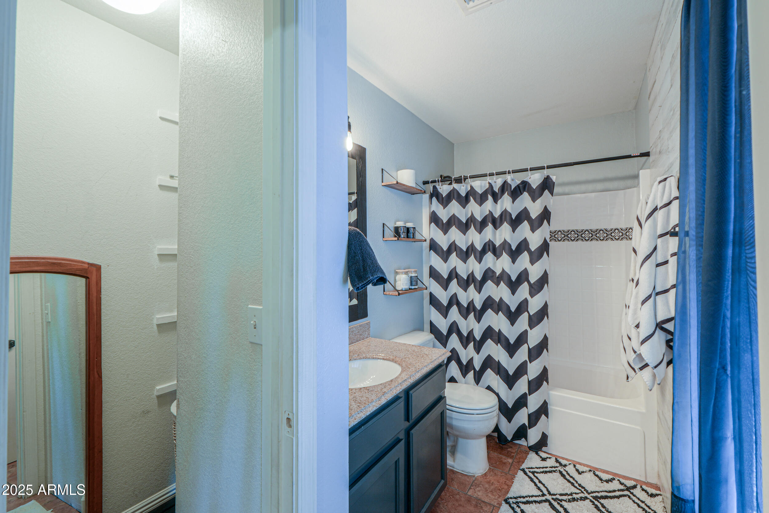 3433 South Chaparral Road Apache Junction, AZ 85119 - Photo 30 of 37 a bathroom with a bathtub and shower