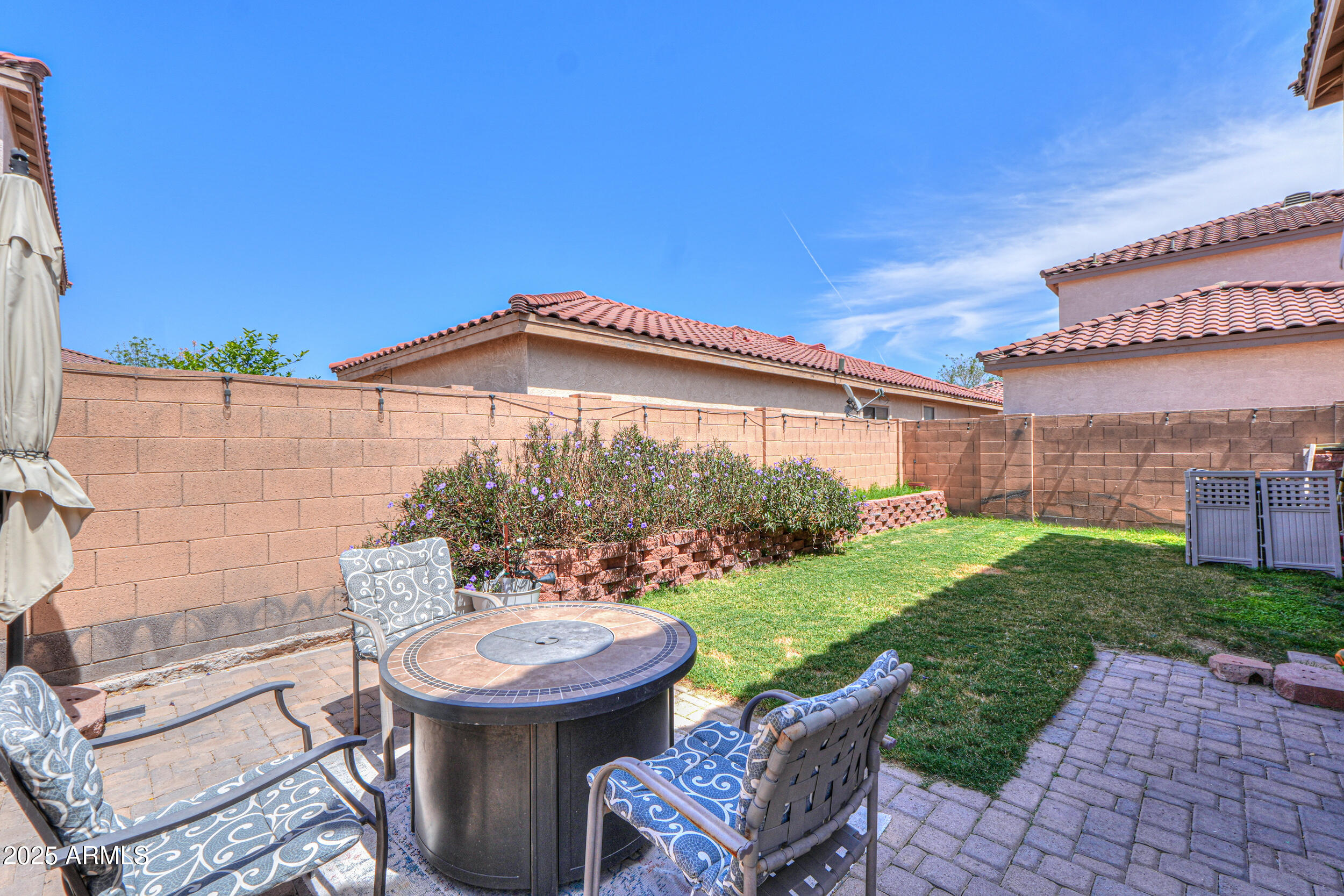 3433 South Chaparral Road Apache Junction, AZ 85119 - Photo 32 of 37 a view of a patio with table and chairs and potted plants